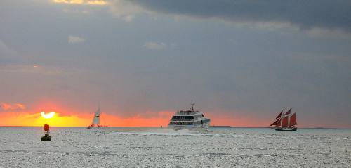 Another Key West Sunset with the Jolly II Rover sailing schooner and the Key West Express 