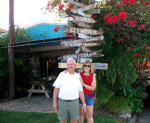 Mike & Joyce and the direction post outside Hogfish Grill in Key West