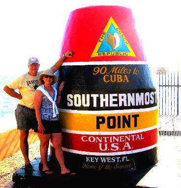 Mike & Joyce Hendrix posing with the Southernmost Point marker