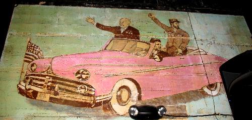 Pink Cadallac with Khrushchev, Castro and Kennedy displayed on west wall of the Bull in Key West, Florida