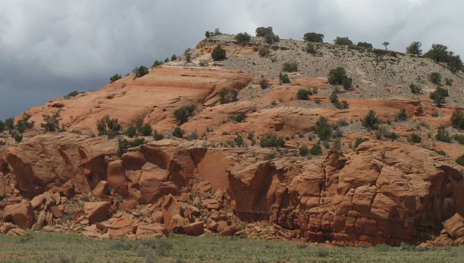 Volcanic ash caprock on this sandstone outcropping near Grants, New Mexico and Mt. Taylor